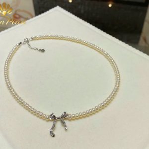 Vòng cổ ngọc trai Baby mix charm nơ