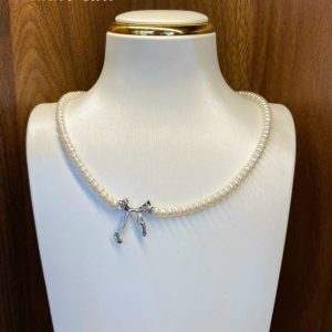 Vòng cổ ngọc trai Baby mix charm nơ