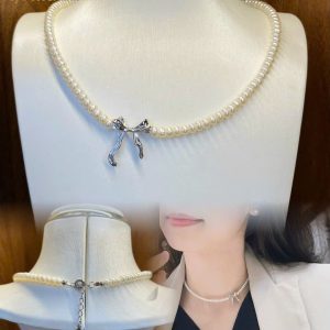 Vòng cổ ngọc trai Baby mix charm nơ
